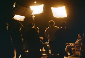 Film crew lighting an interior set during production